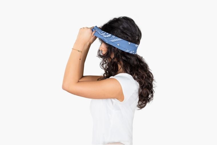 Tie the bandana into a hairband Tie the bandana into a hairband